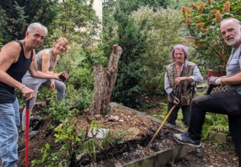 Garden Members posing around the common plot that was recently cleared out