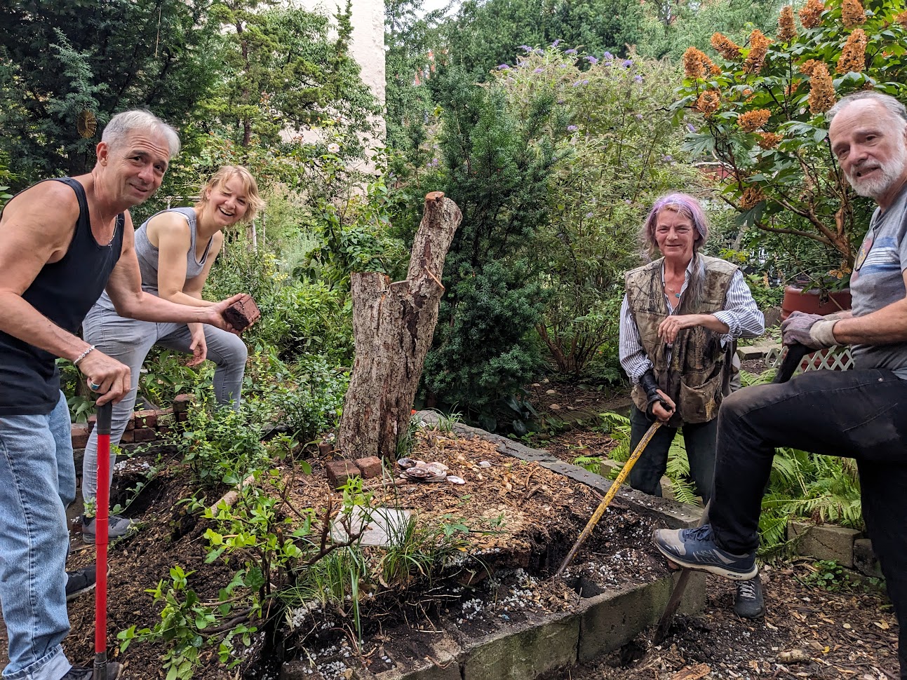 Garden Members posing around the common plot that was recently cleared out